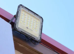 LED floodlight mounted on building exterior wall